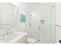 Modern bathroom featuring a glass-enclosed shower with white subway tiles and a sleek vanity with chrome fixtures at 259 Sisson Ne Ave, Atlanta, GA 30317