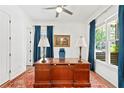 Bright office space features hardwood floors, large windows with blue curtains, and a spacious wooden desk at 259 Sisson Ne Ave, Atlanta, GA 30317