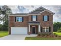 Charming brick two-story home with a welcoming entrance and a two-car garage at 5430 Flat Rock Pt, Stonecrest, GA 30038
