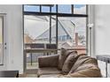 Cozy living area featuring expansive windows with views of the Mercedes-Benz Stadium at 89 Mangum St # 210, Atlanta, GA 30313
