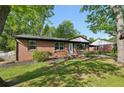 Attractive brick home with fresh landscaping, vibrant green lawn and a well maintained facade at 264 Rockin Hill Dr, Marietta, GA 30060