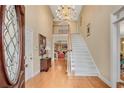 Grand foyer featuring a chandelier, staircase, hardwood floors and decorative stained glass front door at 350 Declaire Ne Way, Marietta, GA 30067