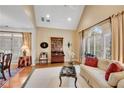 Inviting living room featuring vaulted ceilings, plantation shutters, and an elegant design at 350 Declaire Ne Way, Marietta, GA 30067
