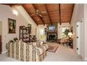Spacious living room with a stone fireplace, wood ceilings and bright, natural light at 2261 Ravenwood Trl, Marietta, GA 30066