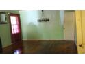 The Living Room features hardwood floors, a window with red curtains, and an old chandelier at 637 Ferris St, Atlanta, GA 30310