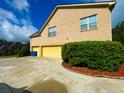 Spacious three car garage provides ample parking, with a large driveway at 842 Treeline Dr, Conyers, GA 30016