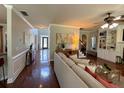 Spacious living room featuring hardwood floors, built-in shelving, and elegant decor at 842 Treeline Dr, Conyers, GA 30016