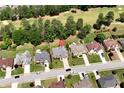 Overhead view of a neighborhood featuring mature trees and well-maintained properties at 960 River Valley Dr, Dacula, GA 30019