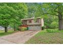 Charming two-story home with a two-car garage and well-maintained front yard at 497 Fire Fly Dr, Tucker, GA 30084