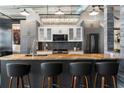 Stylish kitchen showcases modern cabinets, a sleek backsplash, and a large island with seating at 878 Peachtree St # 601, Atlanta, GA 30309