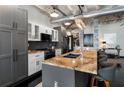 Well-appointed kitchen featuring custom cabinets, granite countertops, and stainless steel appliances at 878 Peachtree St # 601, Atlanta, GA 30309