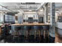Contemporary kitchen featuring a large island, stainless steel appliances, and modern lighting fixtures at 878 Peachtree St # 601, Atlanta, GA 30309
