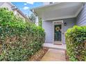 Charming covered front entryway framed by lush greenery offers a private and welcoming entrance at 2865 Winter Rose Ct, Dunwoody, GA 30360