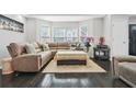 Inviting living room with a comfortable sectional sofa, plush rug, and elegant decor at 4125 Fallbrook Dr, Duluth, GA 30096