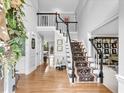 Bright foyer with hardwood floors, staircase and high ceilings, creating an open, welcoming space at 5625 Brookstone Nw Dr, Acworth, GA 30101