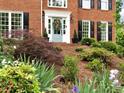 View of the home's entrance, showcasing the front door and landscaping, adding curb appeal at 5625 Brookstone Nw Dr, Acworth, GA 30101