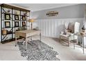 Stylish home office featuring a decorative rug, shelving, and ample natural light, perfect for remote work at 5625 Brookstone Nw Dr, Acworth, GA 30101