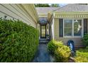 Inviting front entrance with beautiful glass door and manicured landscaping at 2191 Flowering Dr, Grayson, GA 30017