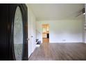 Bright entryway featuring light wood floors and a view of the kitchen at 382 Plantation Blvd, Lawrenceville, GA 30046