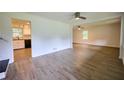Open living room featuring light wood floors and views of the adjacent rooms at 382 Plantation Blvd, Lawrenceville, GA 30046