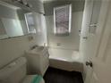 Cozy bathroom featuring a shower-tub combo at 1440 Kenilworth Sw Dr, Atlanta, GA 30310
