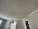 Textured ceiling with a hanging light fixture at 1440 Kenilworth Sw Dr, Atlanta, GA 30310