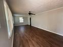 Spacious living room featuring hardwood floors and a ceiling fan at 1440 Kenilworth Sw Dr, Atlanta, GA 30310