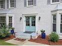 Close up on a charming blue front door with a 