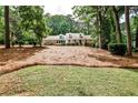 Beautifully landscaped front yard and exterior view of this lovely brick home with dormer windows and covered porch at 2244 Deer Ridge Dr, Tucker, GA 30087