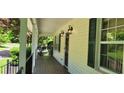 Inviting front porch with decorative lighting, enhancing curb appeal at 294 A Donald Rd, Canton, GA 30114