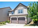 Charming two-story home with a two-car garage, manicured landscaping, and a welcoming front porch at 2753 Trebek Ct, Mcdonough, GA 30253