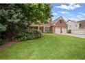 Charming two-story brick home with a lush green lawn and two-car garage at 2955 Pleasant Valley Trl, Cumming, GA 30028