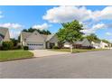 Street view of a well-maintained home with a two-car garage and landscaping, nestled in a friendly neighborhood at 3259 Mcever Park Cir, Acworth, GA 30101