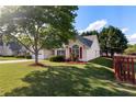 Exterior side view of a single-story home showcasing its well-maintained lawn and charming curb appeal at 3259 Mcever Park Cir, Acworth, GA 30101