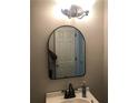 Bathroom showcasing a mirror and vanity under soft lighting for a relaxing space at 75 Oak Hill Dr, Covington, GA 30016