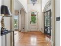 Grand foyer with soaring ceilings, hardwood floors, and ornate details at 3282 Green Farm Trl, Dacula, GA 30019