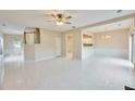 Spacious open-concept room with tile floors, seamlessly connecting the living area, kitchen, and entryway at 3601 Gainesway Trce, Duluth, GA 30096