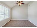 Cozy bedroom with neutral carpet, ceiling fan, and ample natural light at 4889 Hidden Creek Pl, Decatur, GA 30035