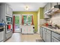 Bright kitchen with stainless steel appliances, granite countertops, and access to the backyard deck at 144 Boones Ridge Se Pkwy, Acworth, GA 30102