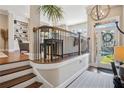 Inviting foyer with hardwood floors, elegant staircase, and a view to the bright and airy living area at 2172 Peach Se Ln, Smyrna, GA 30080