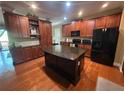 Spacious kitchen featuring stainless steel appliances, granite counters, central island and views to dining at 288 Blue Pointe Ct, Suwanee, GA 30024