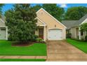 Inviting single Gathering home with manicured lawn, paved driveway, and attached single car garage at 4922 Carson Glen Ln, Acworth, GA 30101