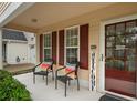 Cozy porch featuring two chairs and a view of the front door and Welcome sign at 4922 Carson Glen Ln, Acworth, GA 30101