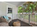 Charming front porch offering a cozy seating area with a view of the neighborhood and lush greenery at 1634 Glenwood Se Ave, Atlanta, GA 30316