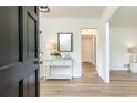 Inviting entryway features a console table with decor, wood flooring, and a view into other rooms at 2730 Burtz Dr, Marietta, GA 30068