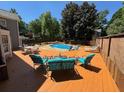 Inviting backyard deck with outdoor seating and a view of the refreshing in-ground pool at 1153 Staples Sw Dr, Lilburn, GA 30047