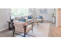 A bright living room with modern decor and lots of natural light at 317 Community Sw Dr, Mableton, GA 30126