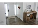 Bright foyer with wood-look flooring, white walls, and stylish decor at 4811 Lake Park Ter, Acworth, GA 30101