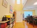 Bright entryway featuring hardwood floors, high ceilings, and a view to the dining area at 634 Friars Head Dr, Suwanee, GA 30024