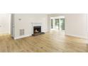 Living room featuring wood-look floors and a fireplace at 906 Country Park Se Dr, Smyrna, GA 30080